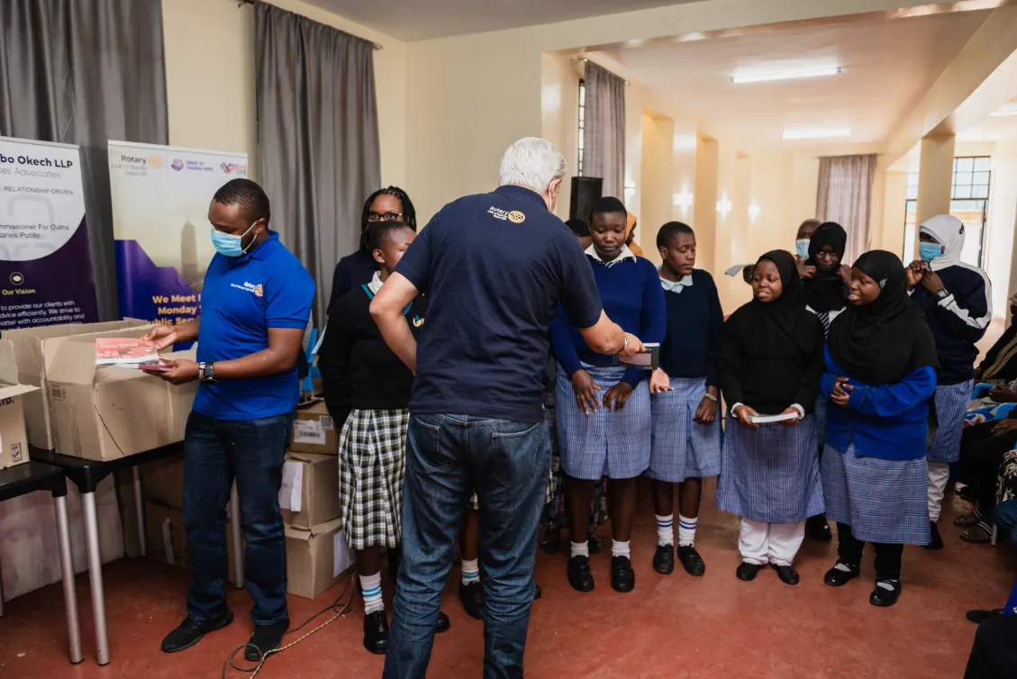 Students receiving donated supplies at the Kibera Girls Soccer Academy